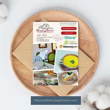 Дизайн на рекламен флаер за бистро WildCherry с информация за доставки и резервации от Art Spot.